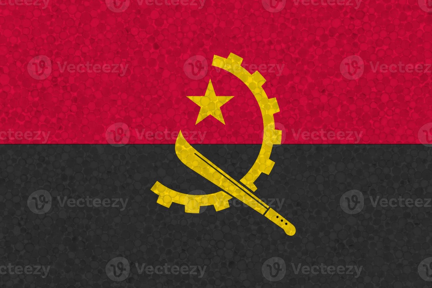 Angola flag on styrofoam texture photo
