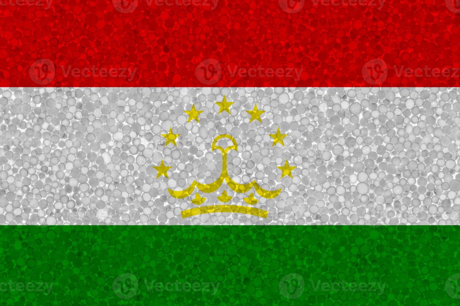 Flag of Tajikistan on styrofoam texture photo