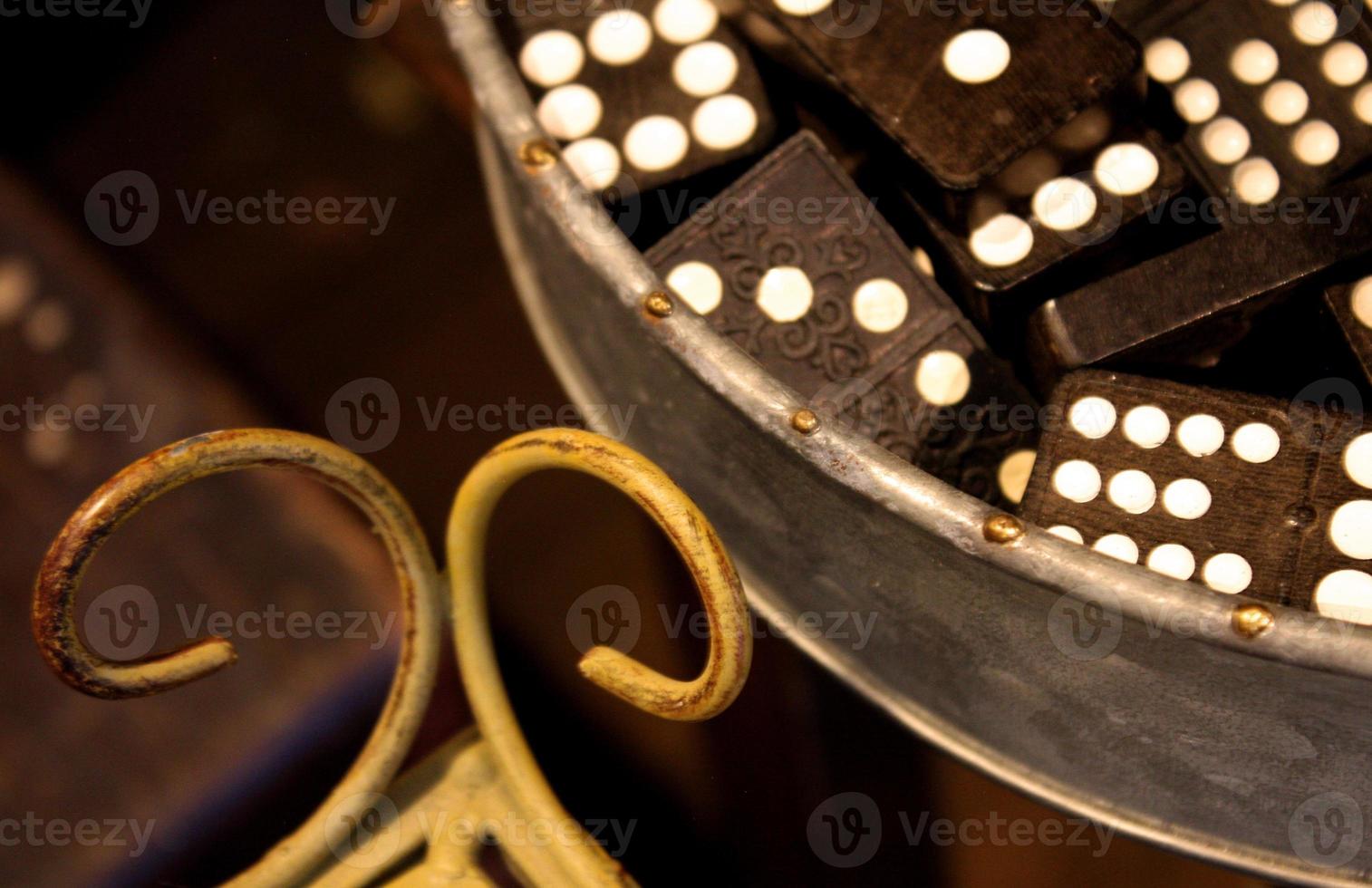 Vintage Collection of Wooden Dominos in a Metal Tray photo