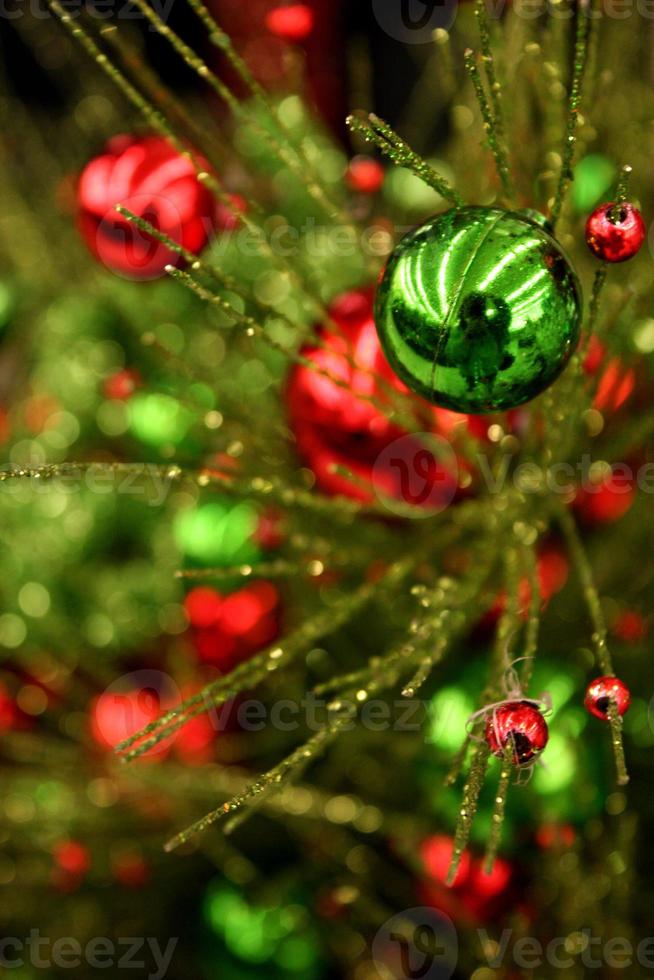 Colorful Spray of Green and Red Metallic Christmas Ornaments photo