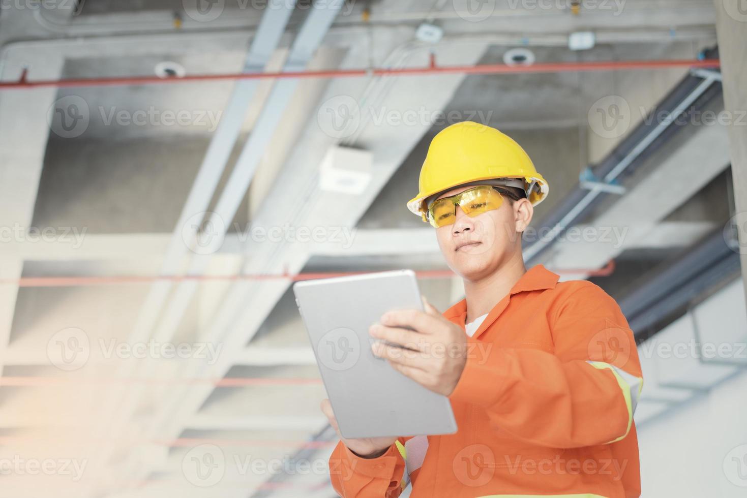 Engineer or foreman holding tablet . job details  Engineering site and working with technology concept. photo