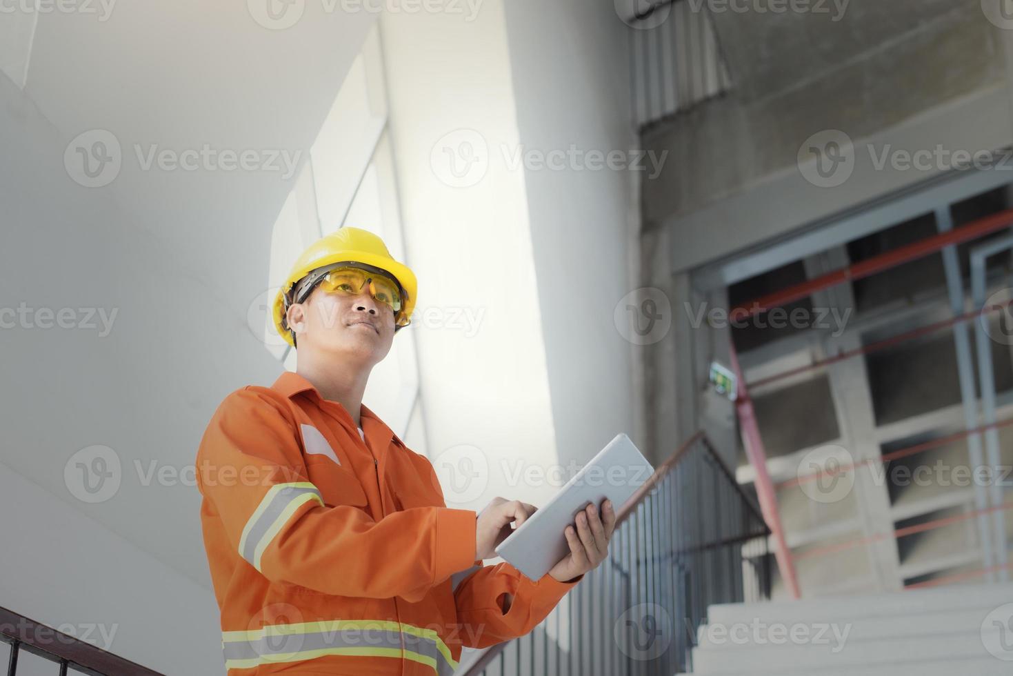 Engineer or foreman holding tablet . job details  Engineering site and working with technology concept. photo