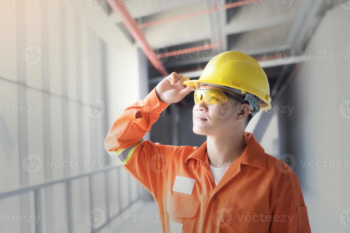 Portrait  Engineer  Industrial  In the Background Industrial Factory . photo