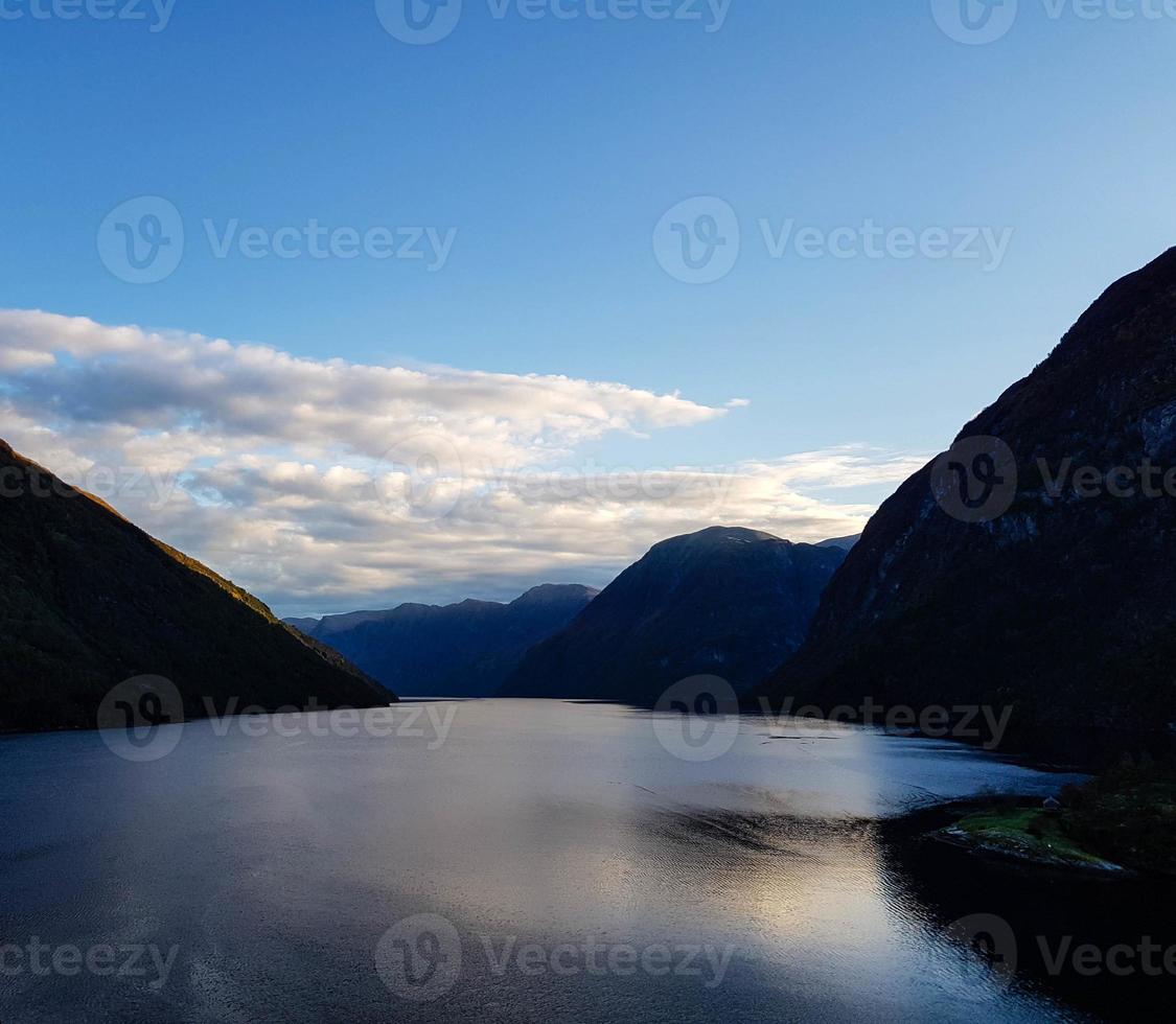 With a cruise ship in the fjords of norway photo