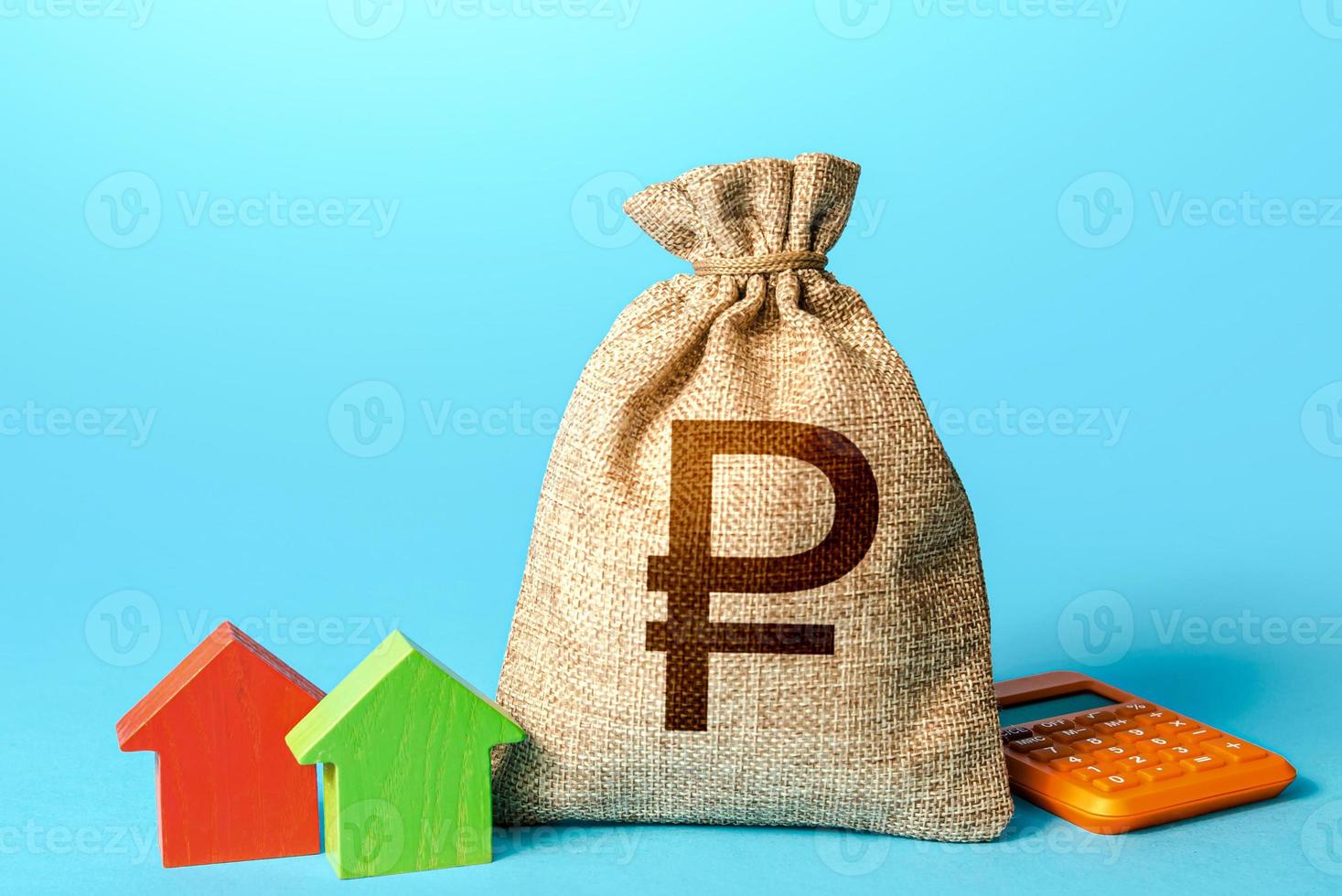 Russian ruble money bag and small houses. Bank offer of mortgage loan. Property appraisal, realtor services. Investments in real estate. Sale of housing. Buy. Rental business. Fair market price photo