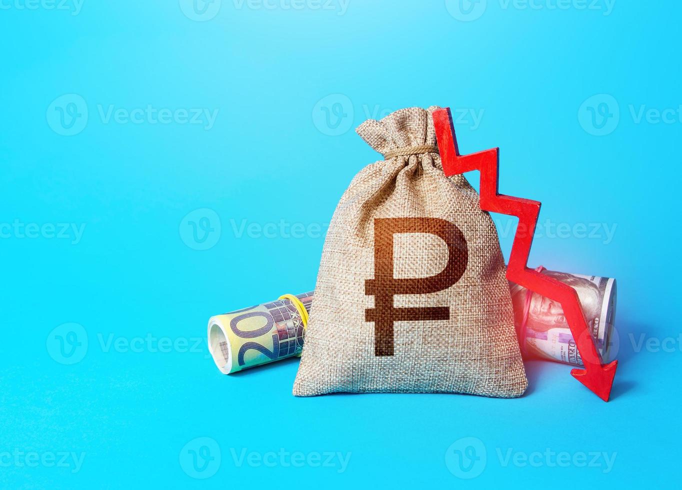 Russian ruble money bag and arrow down. Falling economy. Decrease in interest rate deposit rate. Inflation. Low real incomes, economic difficulties. Unprofitability, recession and depression. photo