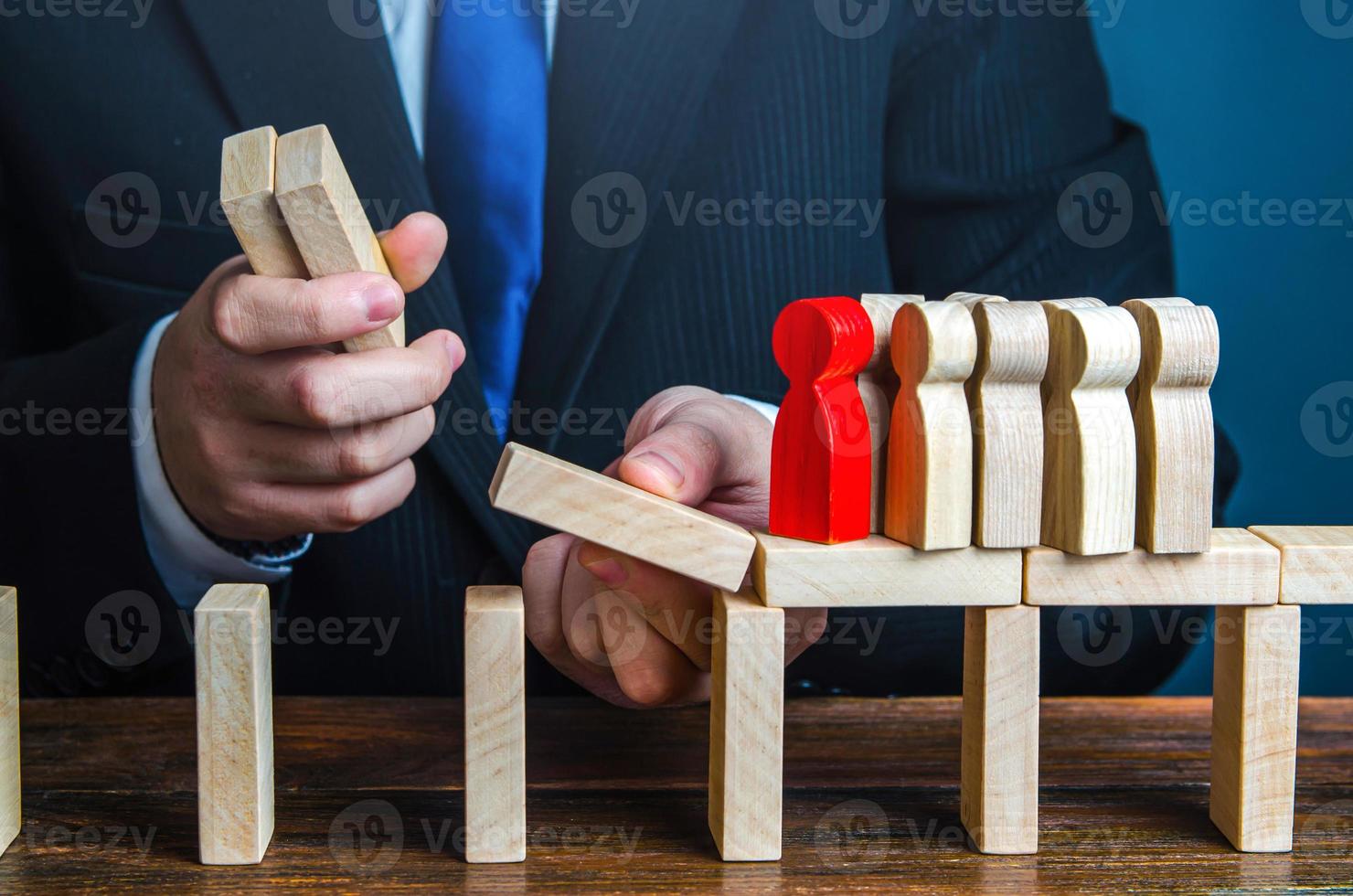 The leader making the way for the team. Simplify business and support entrepreneurship. Insurance. Consulting service. Mentorship and education. Ensuring working conditions, development of employees. photo