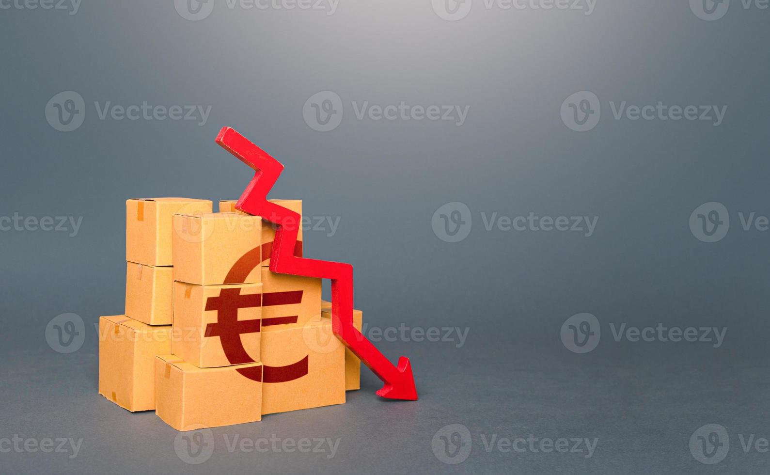 Boxes with euro symbol and down arrow. Decrease in stocks of products. Worsening trade. Embargo, sanctions. Low consumption. Economic slowdown. Price reduction. The fall in the production of goods. photo
