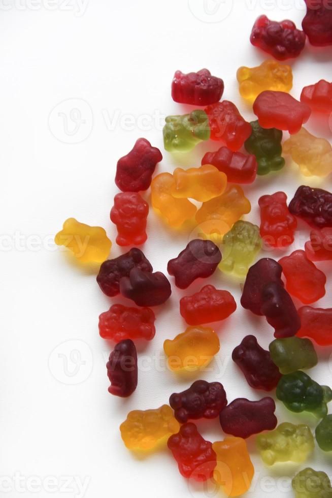 Colorful marmalade bears on a white background. Delicious sweet jelly candies with a large background. photo