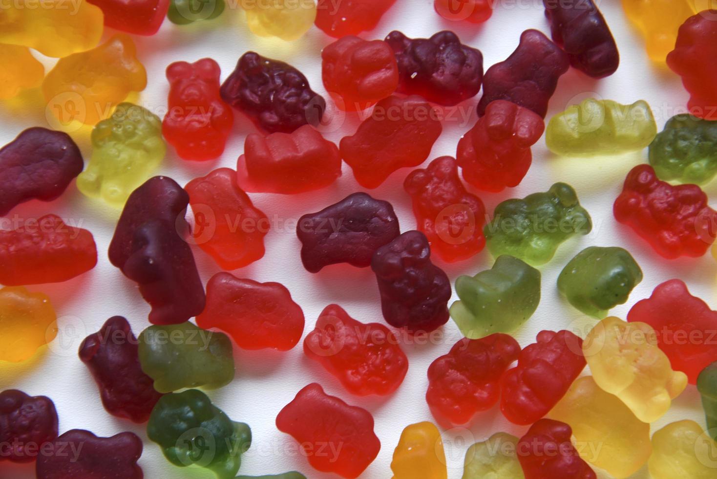 Colorful marmalade bears on a white background. Delicious sweet jelly candies with a large background. photo