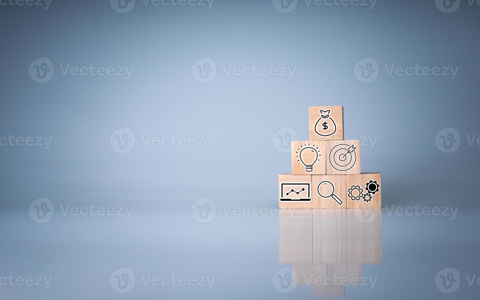 Wood cube block stacking with icon.Concept of business strategy and goal action plan. photo