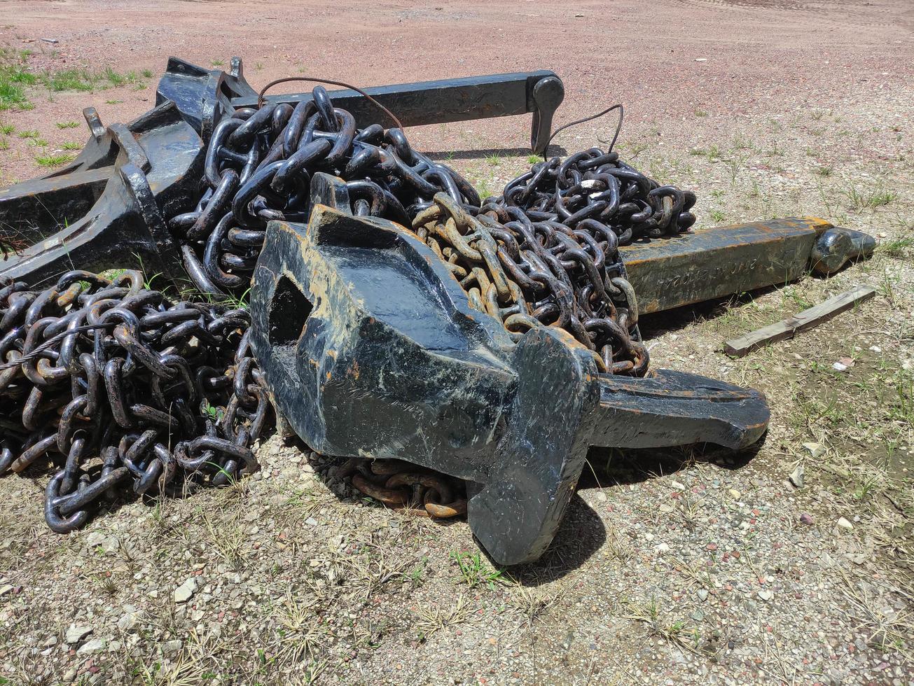 Old anchor. Black anchor of the big sea ship. Huge naval anchor. photo