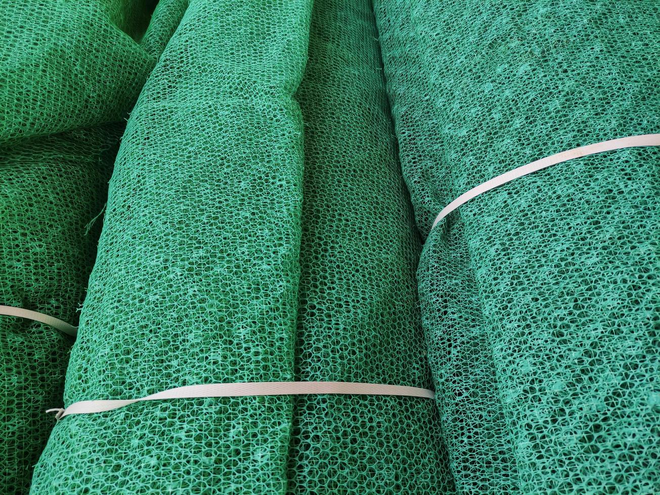 Rolls of green mesh for construction and agriculture, artificial net fencing photo