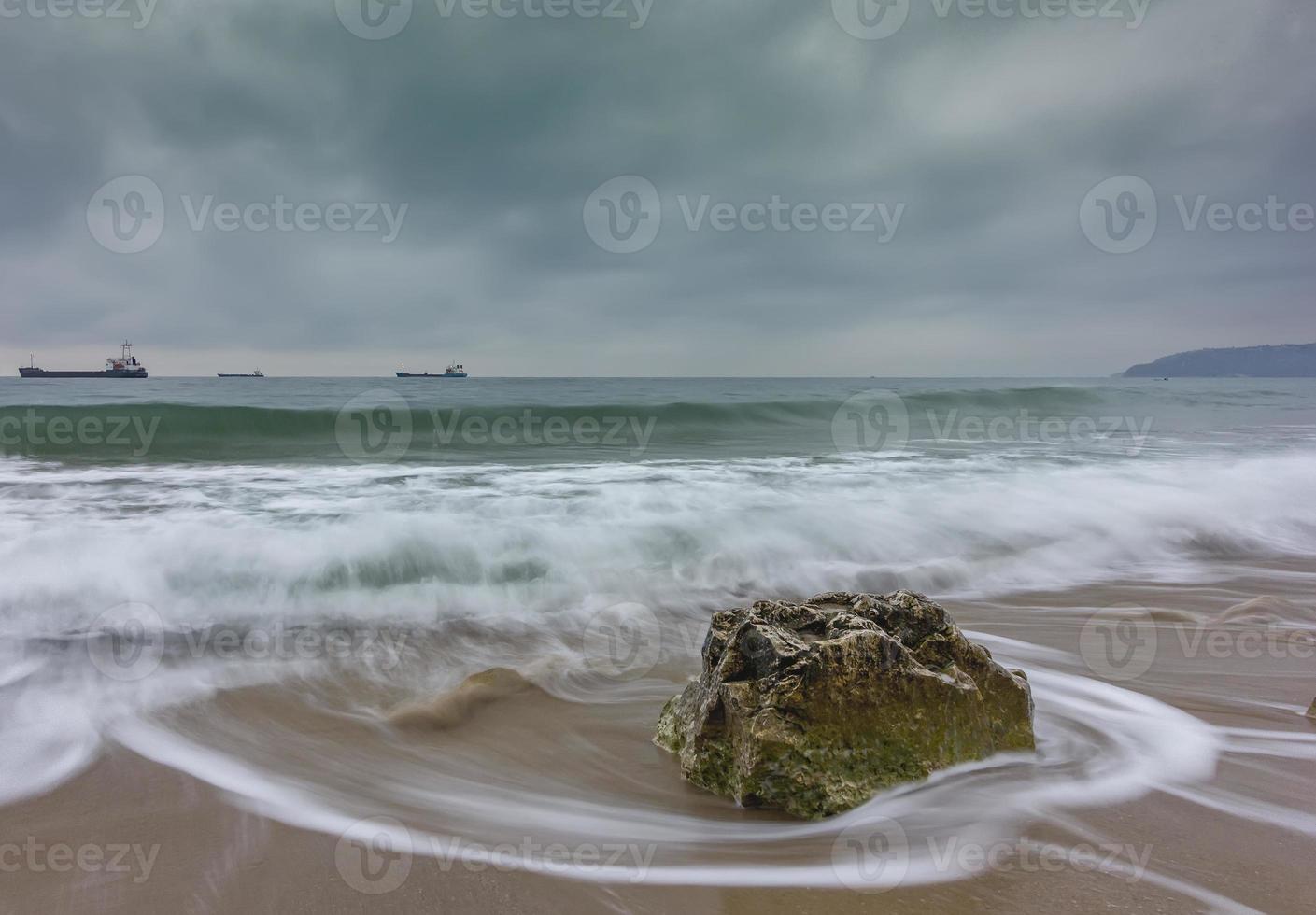 Beauty cloudy, long exposure seascape with slow shutter and waves flowing out. photo