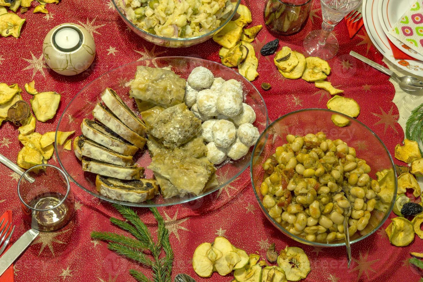 family having lunch at home, top view of the table with food photo