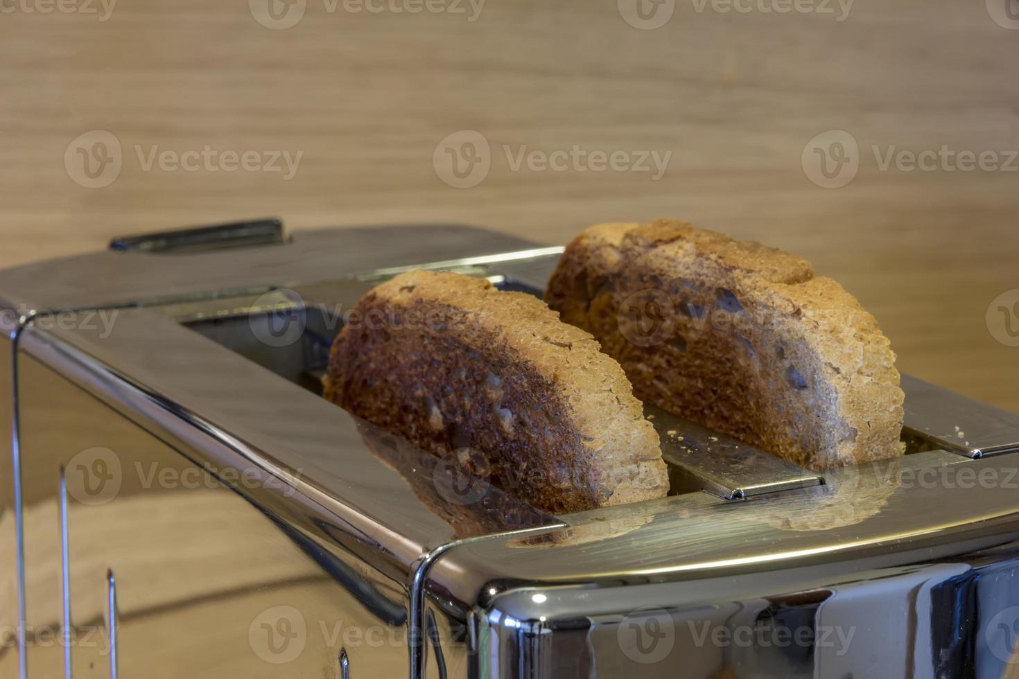 Toaster with toasted bread , Kitchen equipment. Close up. photo