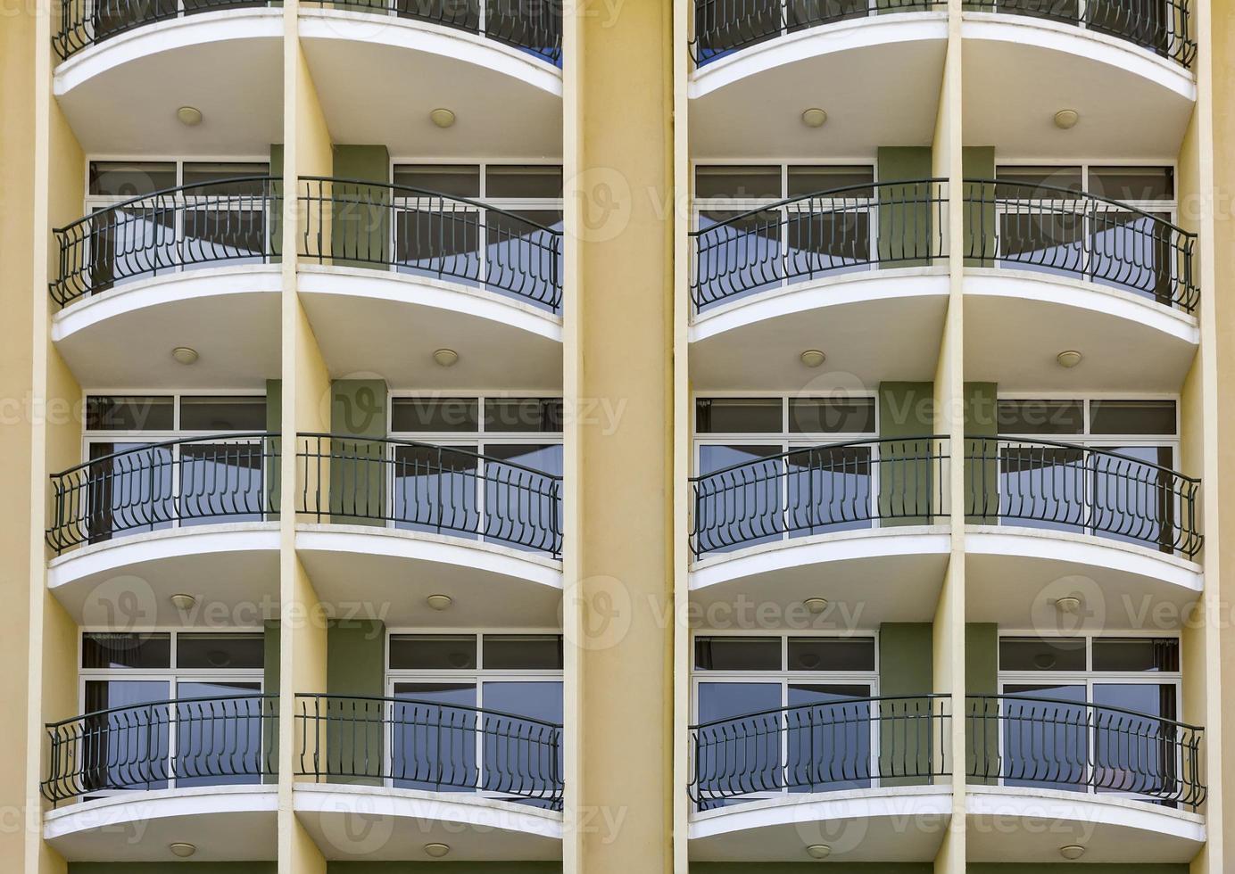 repeating pattern of windows and balcony. photo