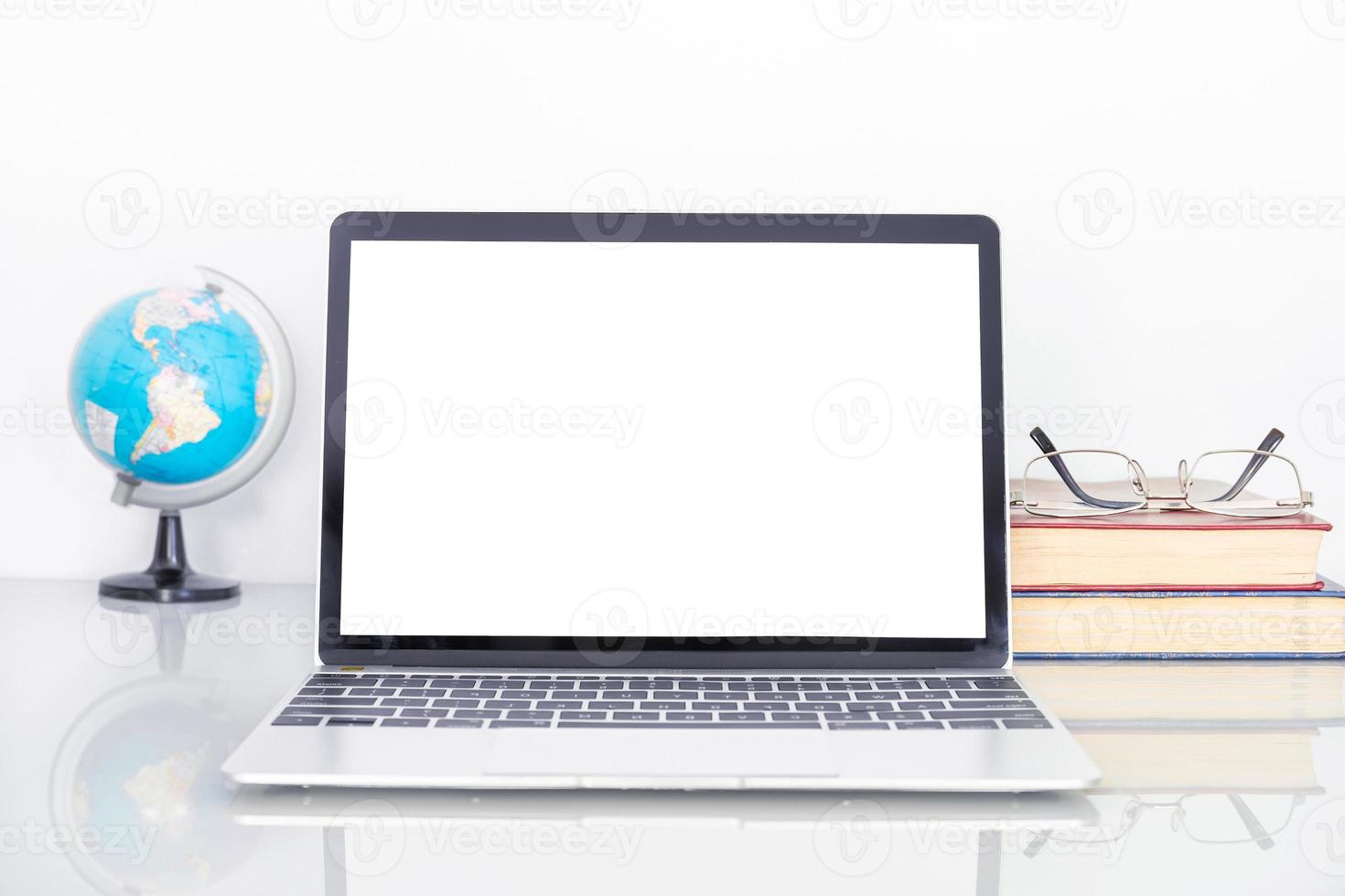 Laptop mockup with blank screen on table photo