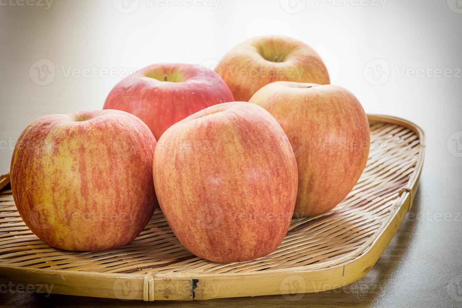 Red apple in basket photo