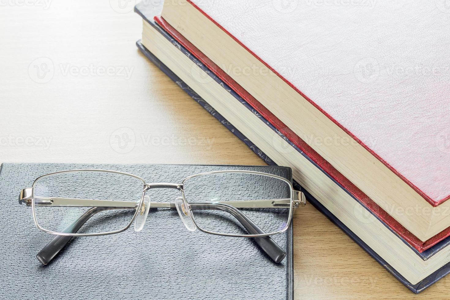 Glasses put on notebook photo