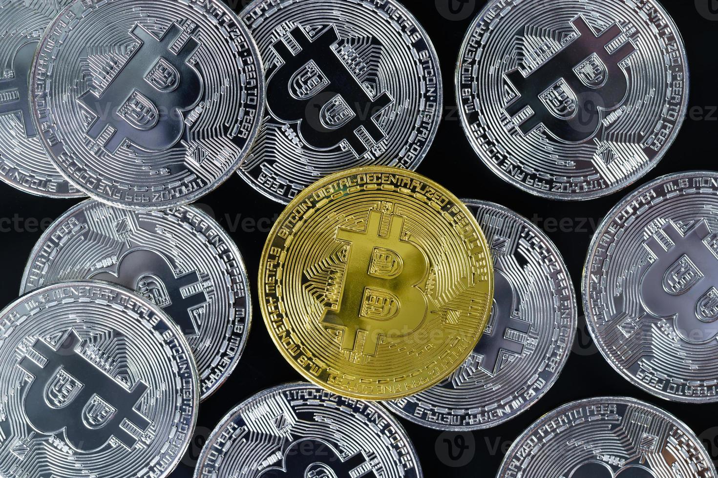 Golden bitcoin and silver coins symbol with coin background photo