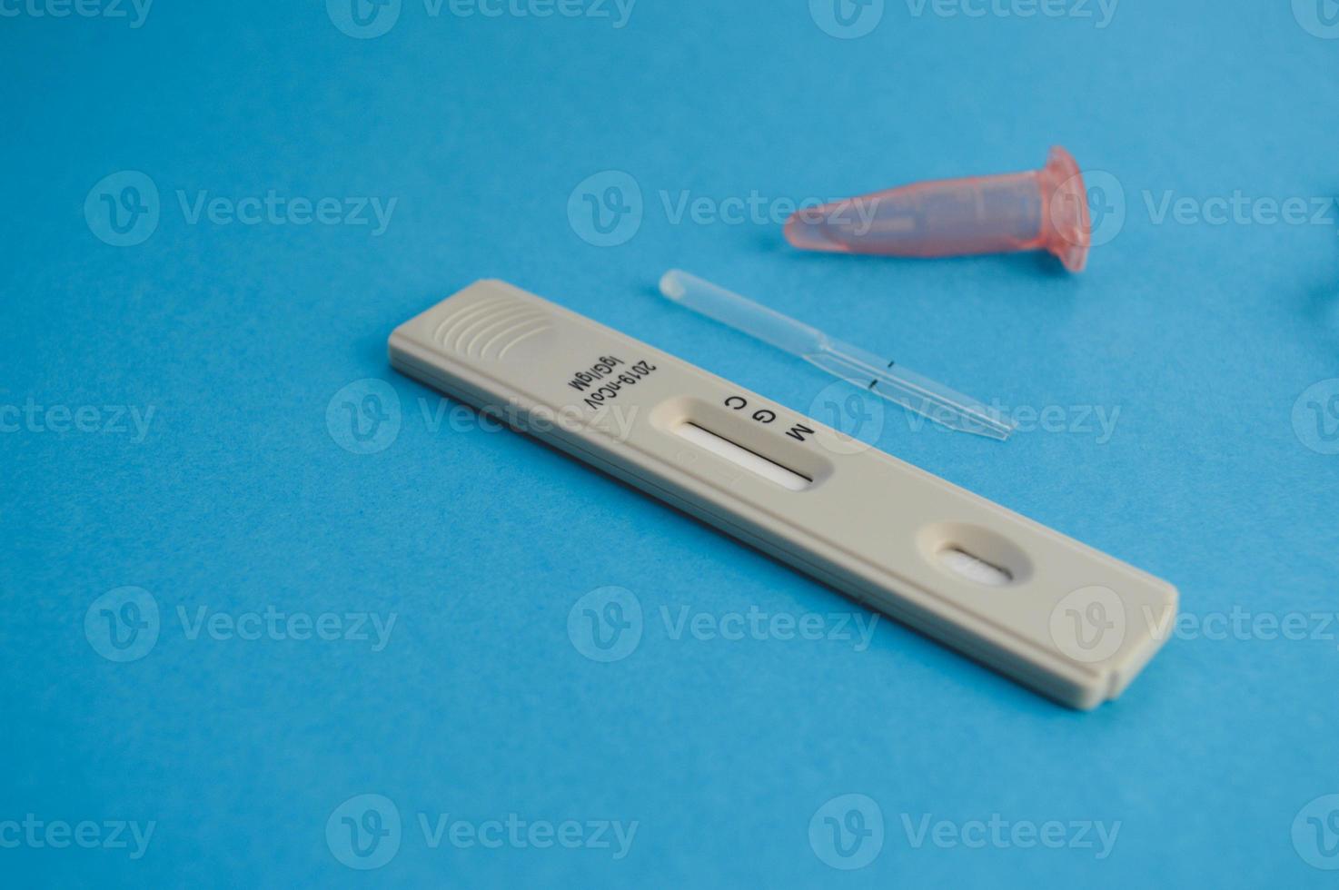 Coronavirus COVID-19 quick Rapid Diagnostic Test RDT,medical worker place collected patient finger prick blood sample specimen on cassette,fast point of care serological diagnostic testing procedure photo