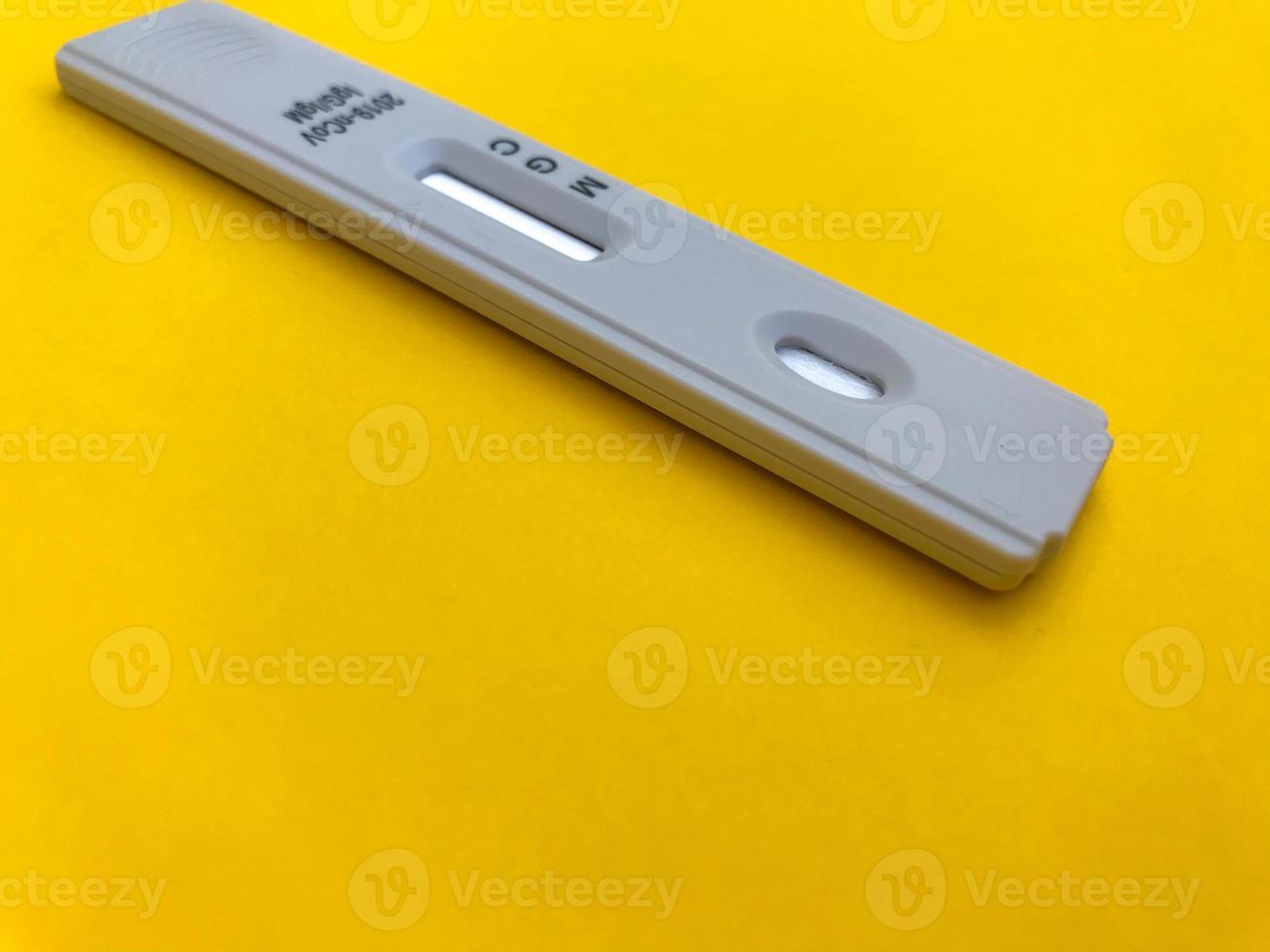 medical procedures. coronavirus test on a bright yellow background. home kit for self-diagnosis. medical procedures for the determination of IgG and IgM antibodies, sensitive test photo