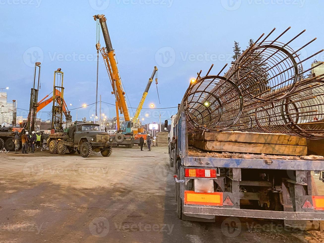 construction of a broken bridge on a busy road. construction equipment on the site erects an overpass. closed area for cars and pedestrians photo