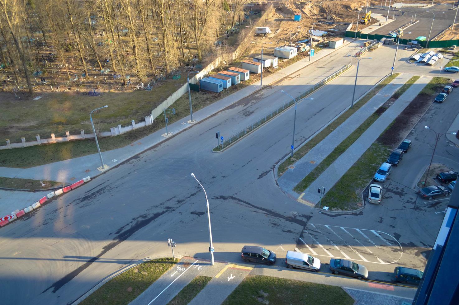 View of a new newly built asphalt road with protective fences with plastic building cones in a big city of a metropolis photo