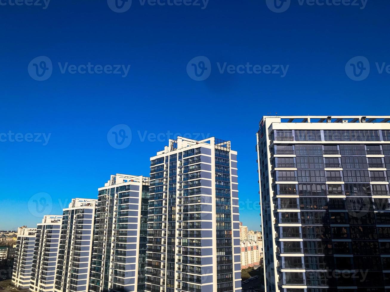 View of the new beautiful residential complex from new buildings with buildings houses monolithic concrete frame panel multi-story skyscrapers of the big city of the metropolis photo