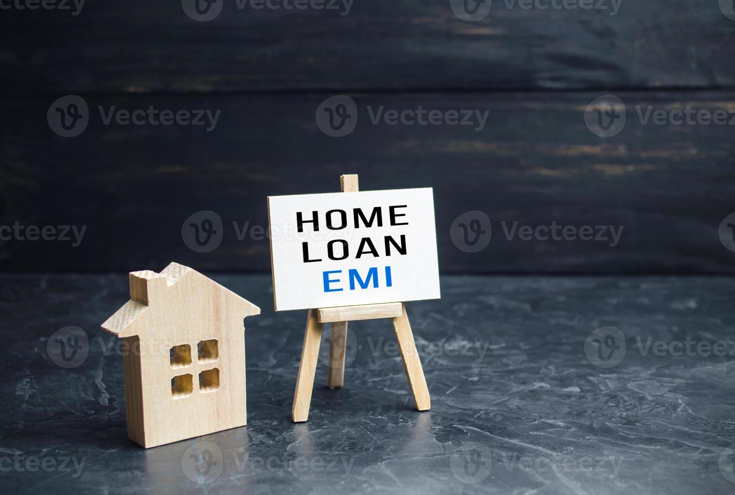 House with home loan EMI easel. Equated Monthly Installment loan. Reducing debt with regular payments over loans period. Attractive interest rates, customized repayment options. Payment plan photo