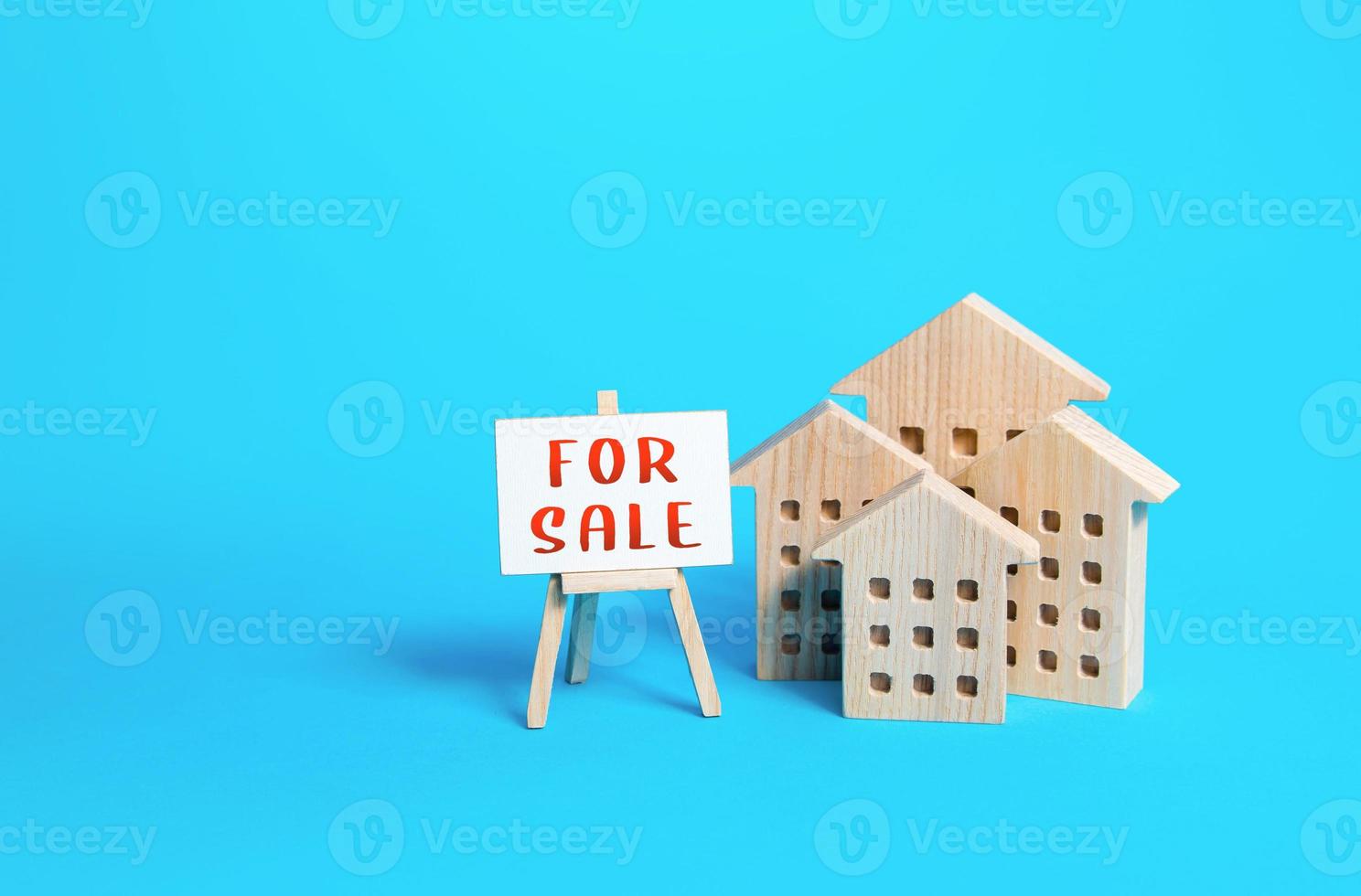 Houses and For Sale sign. Sale of apartments and real estate. Realtor services. Investing in a rental business. Mortgage loans. Construction industry and the secondary realty market. Attractive prices photo