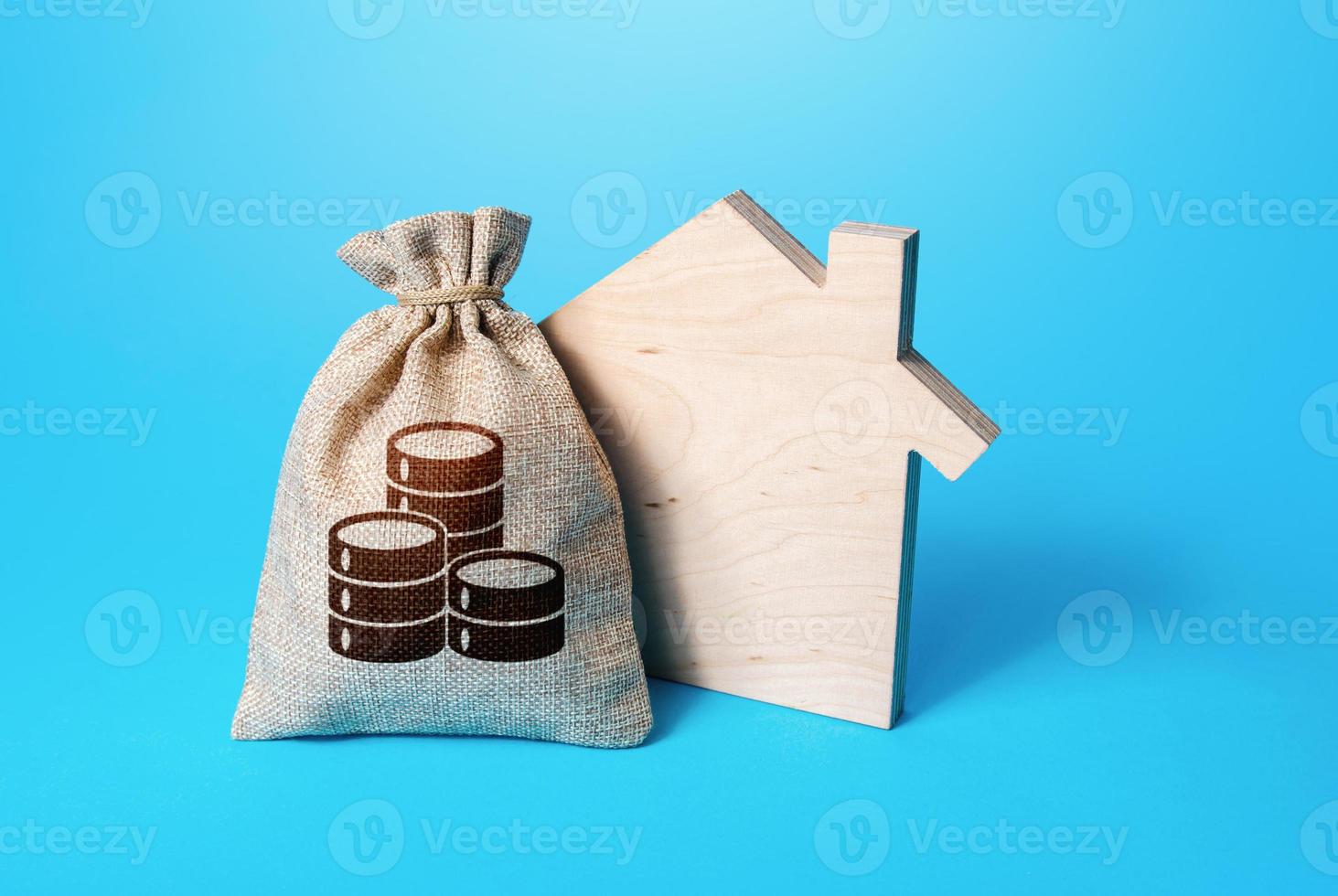 House silhouette and a coin symbol money bag. Home purchase, investment in real estate construction. Mortgage loan. Realtor services. House project development. Rental business. Property appraisal. photo
