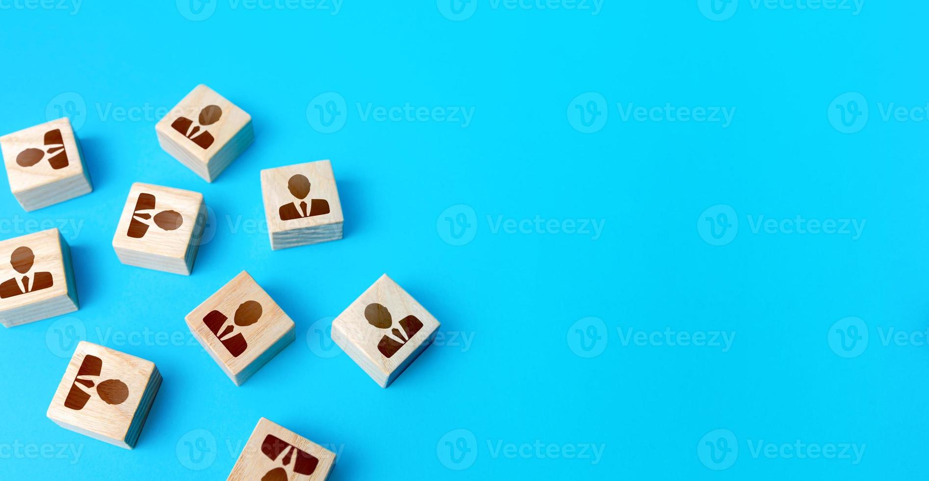 Office workers blocks on blue background. Employment Agency. Recruiting, staffing. Choosing between job candidates. Human resources. Hiring and building relationships in a team. Optimization of staff photo