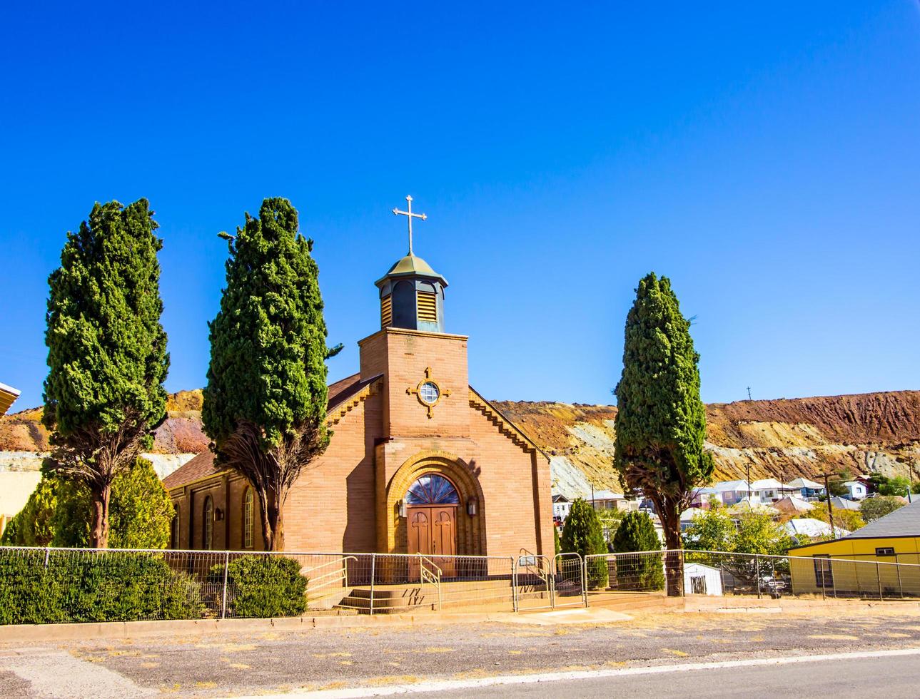 Old Brick Church With Steeple And Double Doors In Mining Town photo