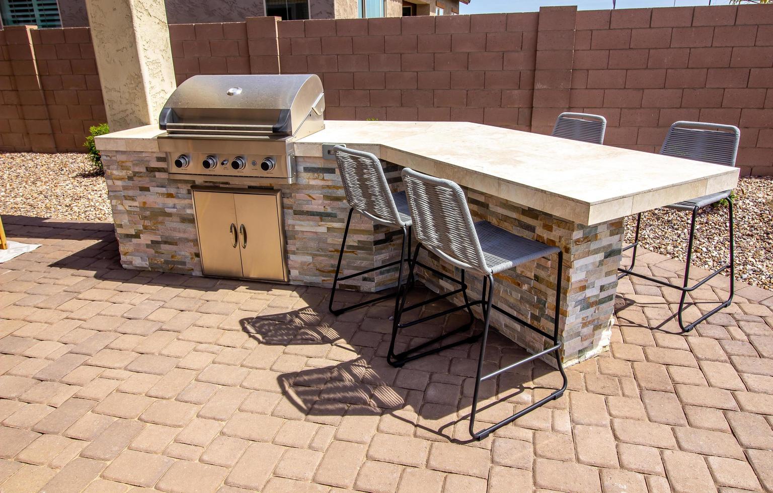 Outside BBQ Station With Four Bar Stools photo