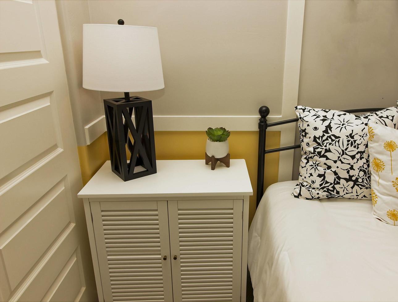 Bedroom Nightstand With Modern Lamp photo