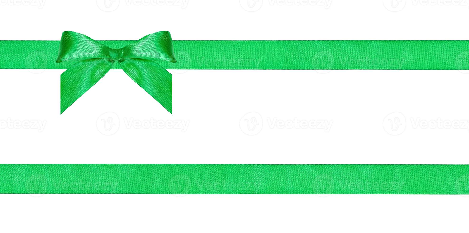 one green bow knot on two parallel silk ribbons photo