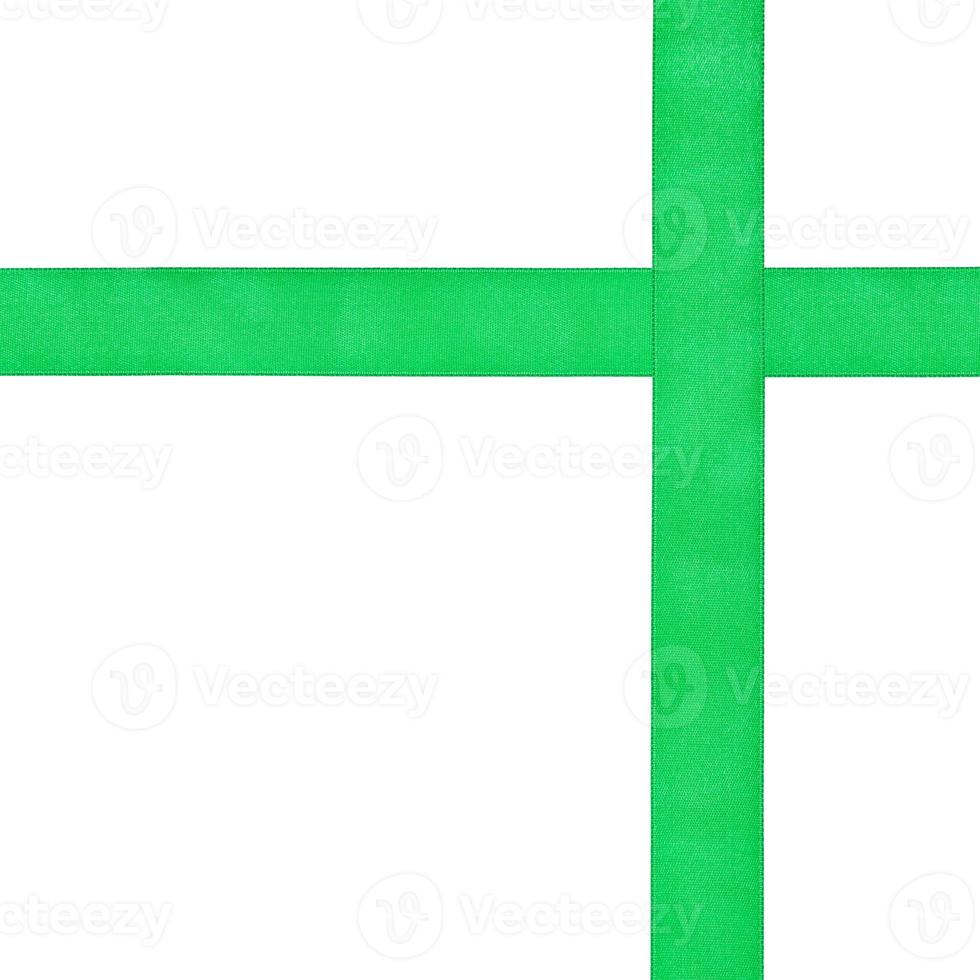 two crossing green satin strips isolated on white photo