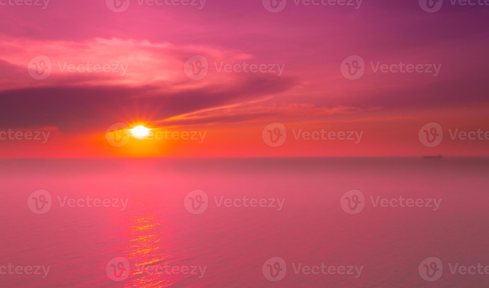 Seascapes of beautiful sunset on the sea beach with pink sky on vacation photo
