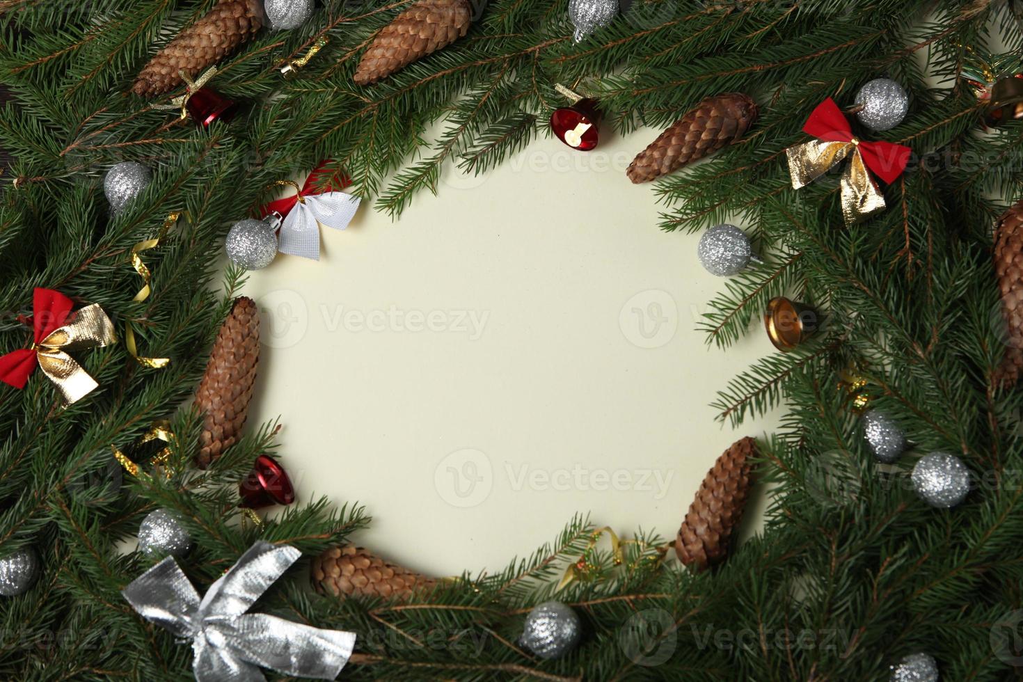 Merry Christmas and Happy Holidays greeting card, frame, banner. New Year. Pine tree branches on white. photo