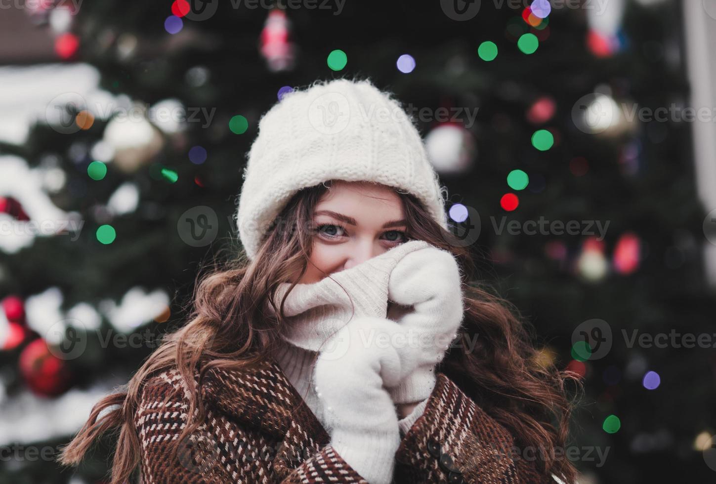 girl in a woolen hat and winter jacket photo