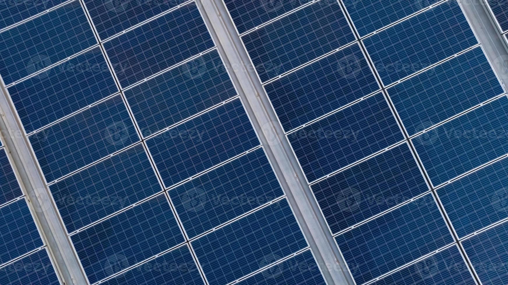 Aerial view of solar panels or photovoltaic module. Solar power for green energy. Sustainable resources. Solar cell panels use sun light as a source to generate electricity. Photovoltaics or PV. photo
