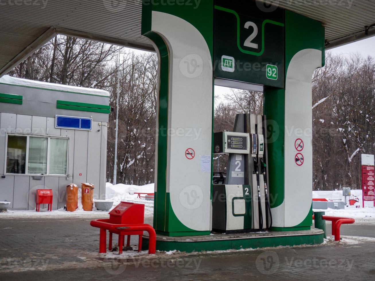 Gas station in the winter city. Petrol. Machine maintenance photo