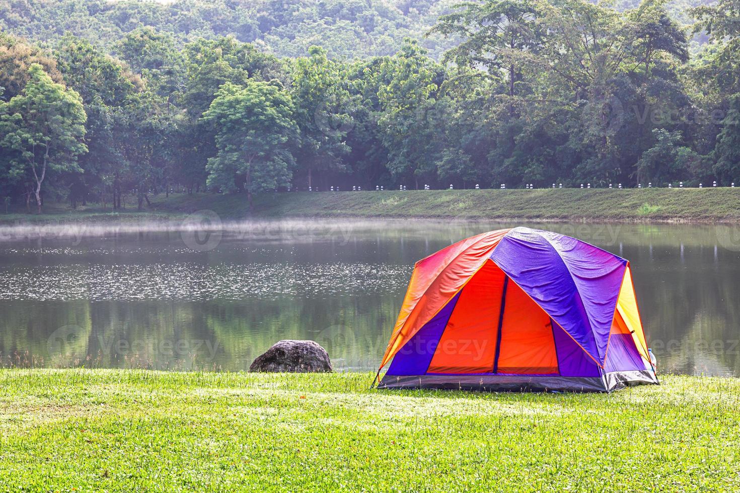 Dome tent camping at lake side photo