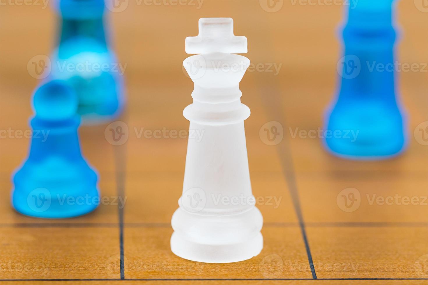 Chess glass on a wood chessboard photo