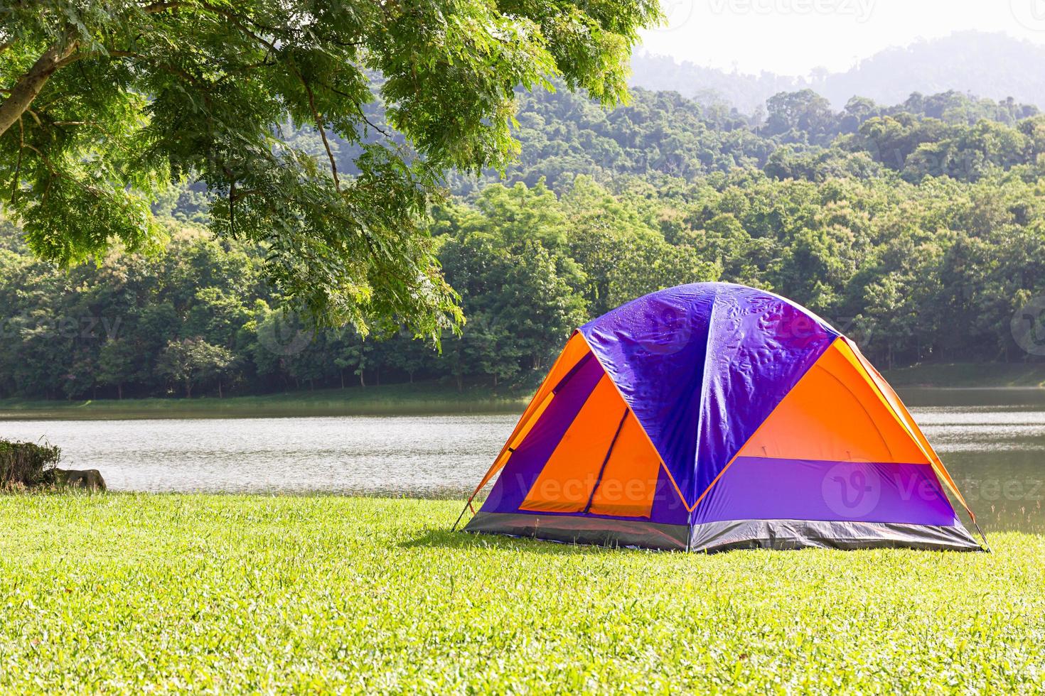 Dome tent camping at lake side photo