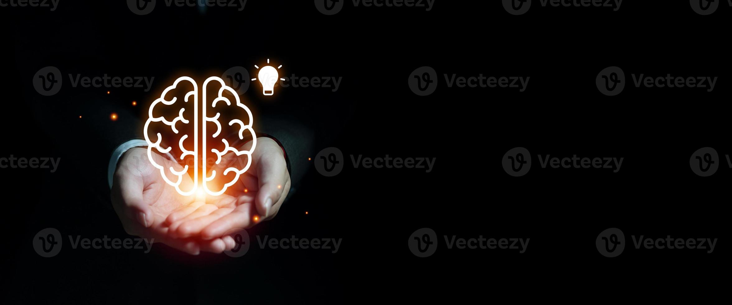 Businessman hands holding and showing creative brain with light bulb icon, Creative ideas of innovative business and technology. New ideas, inspiration and innovation concept. photo