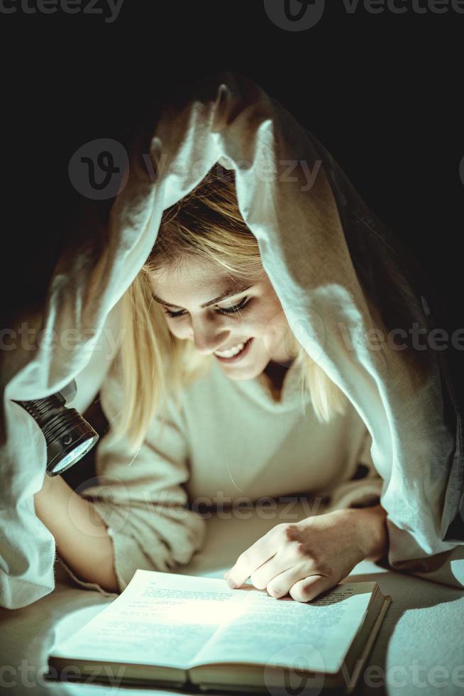 Reading Under Bed Covering photo