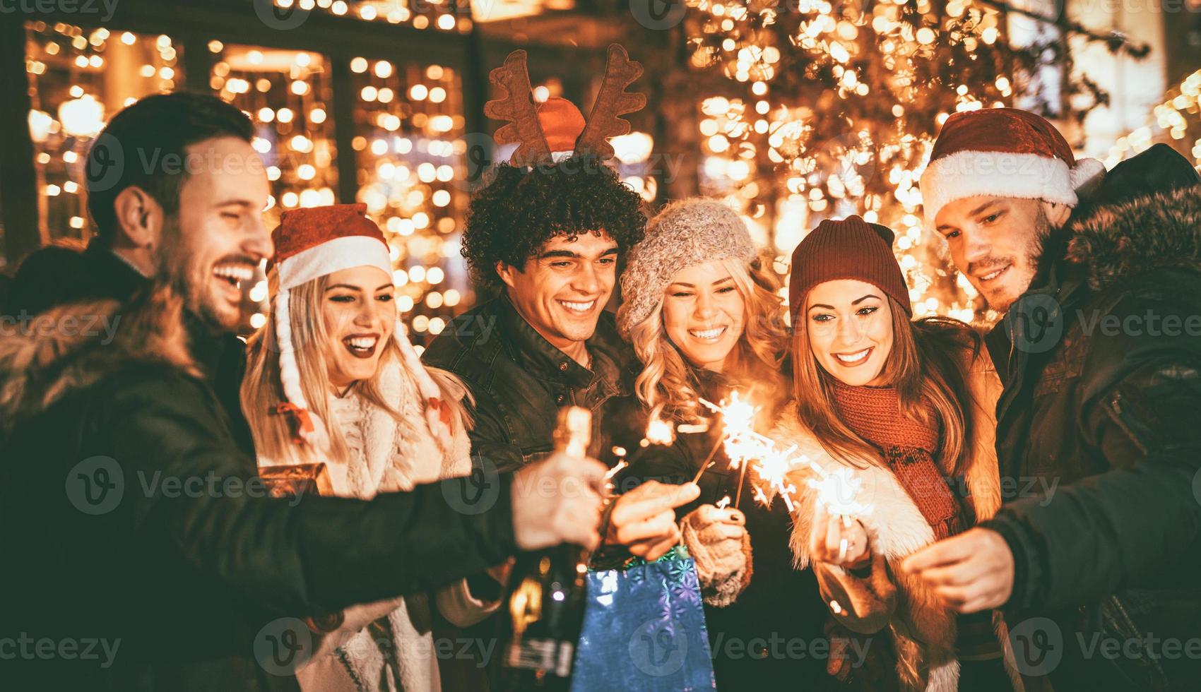 Friends With Sparklers At The New Year Party photo